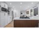 A sleek kitchen features white cabinets, stainless appliances, and hardwood floors at 37 Wagner Cir, Boulder, CO 80304