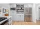 Kitchen with stainless steel refrigerator, gray cabinetry, wood shelves and modern backsplash at 37 Wagner Cir, Boulder, CO 80304