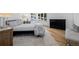Bright main bedroom with light hardwood floors, large windows, and elegant furnishings at 37 Wagner Cir, Boulder, CO 80304