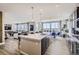 Bright, open kitchen features a large island, modern appliances, and seamless transition to living and dining areas at 1320 Loraine N Cir, Lafayette, CO 80026