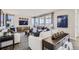 Bright living room showcasing large windows, modern furnishings, and stylish decor for a comfortable space at 1320 Loraine N Cir, Lafayette, CO 80026