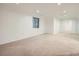 Spacious basement with carpet flooring, natural light, and white walls at 10443 W 84Th Pl, Arvada, CO 80005