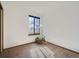 Bedroom featuring a small window, plush carpet, and plant in basket at 10443 W 84Th Pl, Arvada, CO 80005