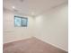 Neutral carpeted bedroom with natural light and a small window at 10443 W 84Th Pl, Arvada, CO 80005