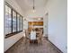 Dining area with large windows providing natural light, seamlessly connects to the kitchen for easy access at 10443 W 84Th Pl, Arvada, CO 80005