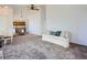 Bright living room flows into the dining area, showcasing an open layout and inviting atmosphere at 10443 W 84Th Pl, Arvada, CO 80005