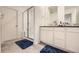 Main bathroom with double vanity, shower, and separate tub at 677 Brookwood Dr, Lafayette, CO 80026