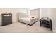 Bright bedroom with plush bed and gray carpeting at 677 Brookwood Dr, Lafayette, CO 80026