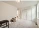 Bedroom with sliding door closet and gray carpet at 677 Brookwood Dr, Lafayette, CO 80026