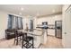 Modern kitchen with island, stainless steel appliances, and ample counter space at 677 Brookwood Dr, Lafayette, CO 80026