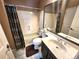 Full bathroom with tub and shower combination and neutral tones at 13474 W 65Th Dr, Arvada, CO 80004