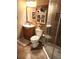 Cozy bathroom with walk-in shower, storage cabinet and toilet at 13474 W 65Th Dr, Arvada, CO 80004