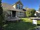 Charming two-story home with landscaped yard, front patio, and inviting curb appeal at 13474 W 65Th Dr, Arvada, CO 80004
