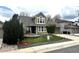 Charming two-story home with well-manicured lawn and inviting front patio area at 13474 W 65Th Dr, Arvada, CO 80004