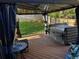 Backyard deck features a modern hot tub, enclosed with black drapes, and a lovely view at 13474 W 65Th Dr, Arvada, CO 80004