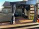 Backyard deck featuring a hot tub under a gazebo with an outdoor television at 13474 W 65Th Dr, Arvada, CO 80004