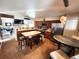 Eat-in kitchen with island seating, stainless steel appliances, and warm wood cabinetry at 13474 W 65Th Dr, Arvada, CO 80004