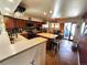 Large open kitchen with island, stainless steel appliances, and eat-in dining space at 13474 W 65Th Dr, Arvada, CO 80004
