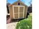 Outdoor storage shed with double doors, providing ample space for lawn and garden equipment at 13474 W 65Th Dr, Arvada, CO 80004