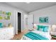 Bright and cheerful bedroom with playful decor, perfect for a space at 1705 S Yuma St, Denver, CO 80223