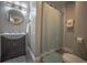 Clean bathroom with shower/tub combo and dark vanity at 408 Soda Creek Rd, Idaho Springs, CO 80452
