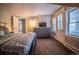 Bright bedroom with a dresser and access to a balcony at 408 Soda Creek Rd, Idaho Springs, CO 80452