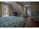 Simple bedroom with a full-size bed and wood floors at 408 Soda Creek Rd, Idaho Springs, CO 80452