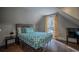 Charming bedroom with a full-size bed and a window at 408 Soda Creek Rd, Idaho Springs, CO 80452