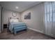 Serene bedroom with teal accents and a cozy bench at the foot of the bed at 408 Soda Creek Rd, Idaho Springs, CO 80452