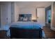 Cozy bedroom with a double bed and dark wood flooring at 408 Soda Creek Rd, Idaho Springs, CO 80452