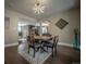 Bright dining room with a wood table and four chairs at 408 Soda Creek Rd, Idaho Springs, CO 80452