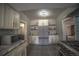 Updated kitchen with stainless steel appliances and ample cabinet space at 408 Soda Creek Rd, Idaho Springs, CO 80452