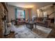 Inviting living room with brown couches and a stone fireplace at 408 Soda Creek Rd, Idaho Springs, CO 80452
