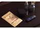 Nightstand with a book, remote, and decor at 408 Soda Creek Rd, Idaho Springs, CO 80452
