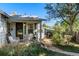 Cozy home featuring a covered porch and charming details at 2862 S Grant St, Englewood, CO 80113