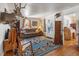 Cozy living room with a large blue rug and wood floors at 2862 S Grant St, Englewood, CO 80113