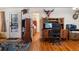 Inviting living room featuring hardwood floors, a comfortable brown couch, rocking chair, and unique decorative wildlife displays at 2862 S Grant St, Englewood, CO 80113