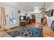 Bright living room with vintage decor and a view of the front door at 2862 S Grant St, Englewood, CO 80113