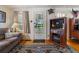 Relaxing living room featuring a couch, TV, and ornate rug at 2862 S Grant St, Englewood, CO 80113