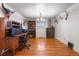 Functional home office with a desk, storage, and hardwood floors at 2862 S Grant St, Englewood, CO 80113