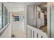 Enclosed porch featuring natural lighting, a view of the outdoors, and stairs leading to the kitchen at 2862 S Grant St, Englewood, CO 80113