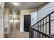 Interior hallway with stairs leading to multiple units, providing access to residential apartments at 5705 N Genoa Way # 206, Aurora, CO 80019