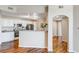 Bright kitchen with white cabinets, stainless steel appliances, and an open layout at 5705 N Genoa Way # 206, Aurora, CO 80019