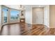Bright living room with a fireplace, large windows, and gleaming hardwood floors at 5705 N Genoa Way # 206, Aurora, CO 80019
