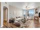 Cozy living room featuring a fireplace, stylish furniture, and access to a balcony at 5705 N Genoa Way # 206, Aurora, CO 80019