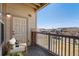 Covered patio with cozy seating and neighborhood views, perfect for relaxing outdoors at 5705 N Genoa Way # 206, Aurora, CO 80019