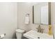 Simple and clean bathroom with a sink and toilet at 16058 E Geddes Ln # 26, Aurora, CO 80016