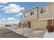 Townhouse exterior with attached garage and partial view of the surrounding area at 16058 E Geddes Ln # 26, Aurora, CO 80016