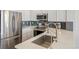 Modern kitchen features stainless steel appliances and white cabinetry at 16058 E Geddes Ln # 26, Aurora, CO 80016