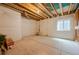 Unfinished basement with window, exposed ceiling and wrapped walls, and concrete flooring is ready to be personalized at 3008 Blithe Pt, Castle Rock, CO 80108
